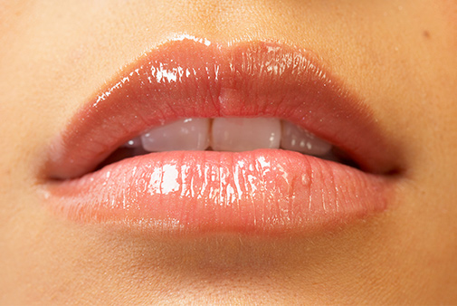 glossy lips with teeth showing